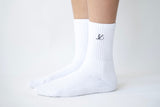 close-up of the embroidered luméa logo on the pure pilates sock