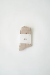 luméa taupe pilates sock in its packaging